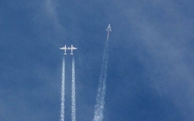 The Virgin Galactic SpaceShipTwo rocket separates from the carrier aircraft prior to it exploding in the air during a test flight on Friday, Oct. 31, 2014. (photo credti: AP/Kenneth Brown)