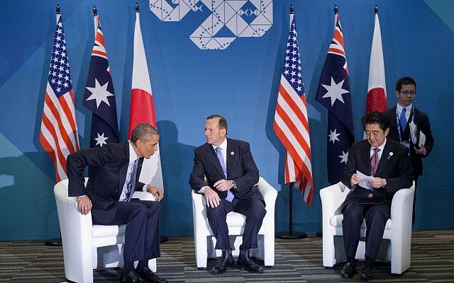 US President Barack Obama, left, Australian Prime Minister Tony Abbott, center, and Japanese Prime Minister Shinzo Abe, right, at the start of their meeting at the G20 Summit in Brisbane, Australia, Sunday, November 16, 2014. (photo credit: AP/Pablo Martinez Monsivais) US President Barack Obama, left, Australian Prime Minister Tony Abbott, center, and Japanese Prime Minister Shinzo Abe, right, at the start of their meeting at the G20 Summit in Brisbane, Australia, Sunday, November 16, 2014. (photo credit: AP/Pablo Martinez Monsivais)