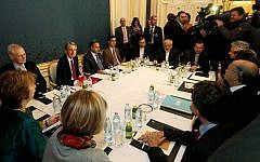Former EU foreign policy chief Catherine Ashton, left, British Foreign Secretary Philip Hammond, third left, Iranian Foreign Minister Mohammad Javad Zarif, rear center, and French Foreign Minister Laurent Fabius, second right, wait for the start of closed-door nuclear talks with Iran in Vienna, Austria, Friday, Nov. 21, 2014. (Photo credit: AP/Ronald Zak)