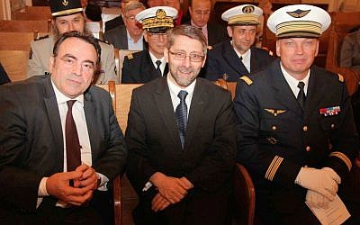 Chief French Rabbi Haim Korsia (center), with Consistoire President Joel Mergui (left), and French army officers at a synagogue in Paris, November 6, 2014. (photo credit: JTA/Alain Azria)