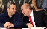 File photo: Then prime minister Ehud Olmert (right) talks to then defense minister Ehud Barak at a cabinet meeting held in July 2007. (Photo credit: Ariel Jerozolimski/Flash90)