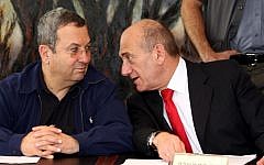 Prime minister Ehud Olmert (right) talks to defense minister Ehud Barak at a cabinet meeting, July 4 2007. (photo credit: Ariel Jerozolimski/Flash90)