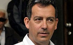 Benny Tavin is brought into the Magistrate's Court in Tel Aviv on April 14, 2010. (Photo credit: Yossi Zeliger/FLASH90)