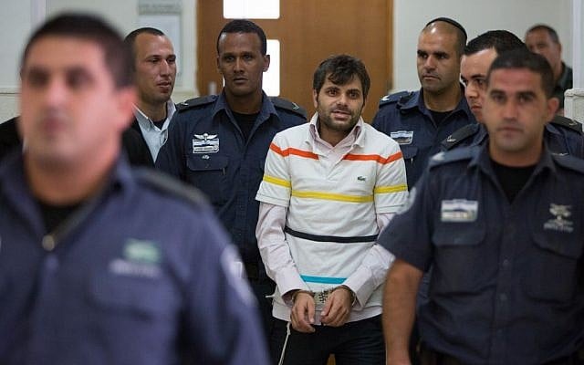 Police escort Yosef Haim Ben-David, one of the suspects in the murder of Muhammed Abu Khdeir, in the District Court in Jerusalem after his arrest in July, 2014. (Photo by Yonatan Sindel/Flash90) Police escort Yosef Haim Ben-David, one of the suspects in the murder of Muhammed Abu Khdeir, in the District Court in Jerusalem after his arrest in July, 2014. (Photo by Yonatan Sindel/Flash90)