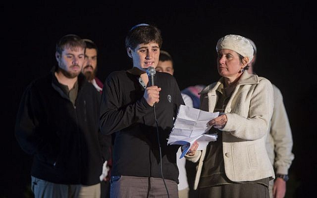 The son and wife of Yehudah Glick speak during a prayer rally at Safra Square in Jerusalem on November 1, 2014. (Photo credit: Yonatan Sindel/Flash90) The son and wife of Yehudah Glick speak during a prayer rally at Safra Square in Jerusalem on November 1, 2014. (Photo credit: Yonatan Sindel/Flash90)
