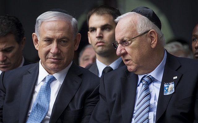 Prime Minister Benjamin Netanyahu (left) seen with President Reuven Rivlin at a memorial service marking 19 years since the assassination of late prime minister Yitzhak Rabin, held at Mount Herzl cemetery in Jerusalem. November 5, 2014. (photo credit: Miriam Alster/Flash90)
