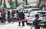 Israeli security personnel at the site where an Arab man from the East Jerusalem neighborhood of Shuafat drove his car into a crowd of people waiting by the Shimon ha Tzadik light rail station in Jerusalem injuring at least 8 people, and killing one bystander, November 05, 2014. (photo credit: Yonatan Sindel/FLASH90)