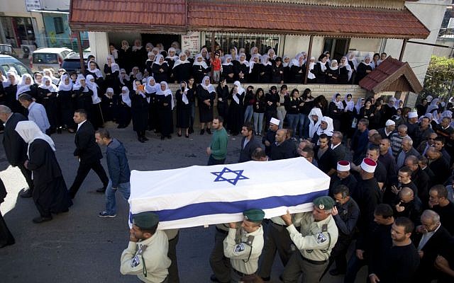 Thousands attend the funeral of slain Israeli Border Police officer Jedan Assad, in the northern Druze village of Beit Jann, on November 06, 2014. (Photo credit: FLASH90)