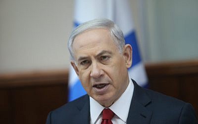 Prime Minister Benjamin Netanyahu speaks during the weekly cabinet meeting on Sunday, November 9, 2014. (photo credit: Alex Kolomoisky/POOL)