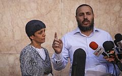 The parents of injured IDF soldier Moshe Aharoni speak to the media outside the Hadassah Ein Kerem hospital emergency unit where Moshe is hospitalized, on November 9, 2014. (photo credit: Hadas Parush/Flash90)