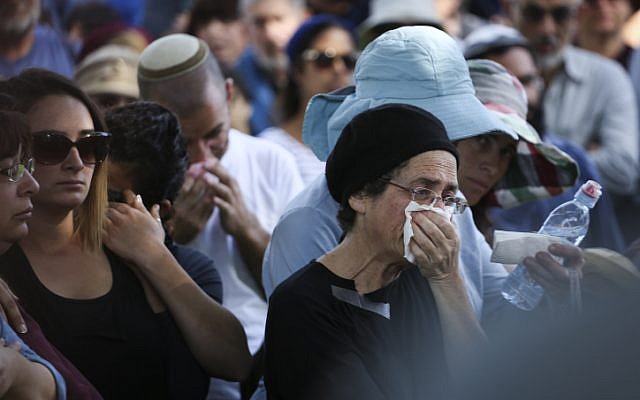 Friends and family seen mourning during the funeral ceremony of Dalia Lemkus at the Jewish settlement of Tekoa in the West Bank on November 11, 2014. (photo credit: Hadas Parush/Flash90) Friends and family seen mourning during the funeral ceremony of Dalia Lemkus at the Jewish settlement of Tekoa in the West Bank on November 11, 2014. (photo credit: Hadas Parush/Flash90)