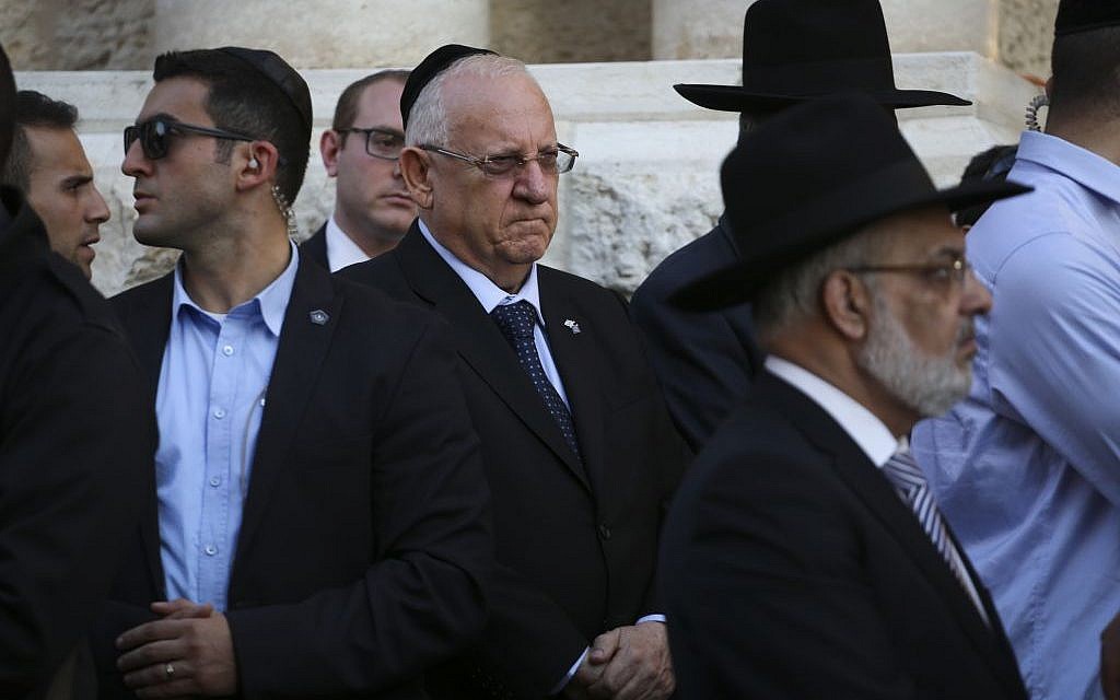 President Reuven Rivlin attends the funerals of four Jewish men murdered at prayer in a Har Nof synagogue in Jerusalem by Palestinian terrorists on November 18, 2014. (Photo credit: Hadas Parush/Flash90)