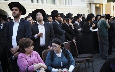 Hundreds attend the funeral ceremony of three out of the four victims who were murdered by two Palestinians at a synagogue in the Ultra-Orthodox Har Nof neighborhood in Jerusalem on November 18, 2014. (photo credit: Hadas Parush/Flash90) 