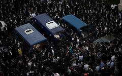 Thousands attend the funeral of three of the four victims killed in an attack on a synagogue in Har Nof, Jerusalem, November 18, 2014 (photo credit: Miriam Alster/Flash90)