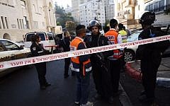 Israeli police and rescue workers outside the Kehilat Yaakov synagogue in Jerusalem after a terror attack there on November 18, 2014. (photo credit:  Yonatan Sindler/FLASH90)