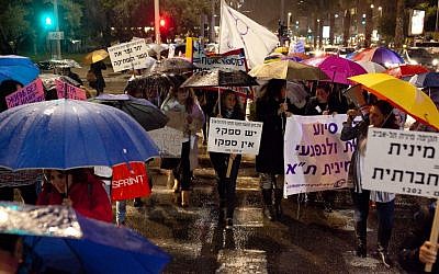 Dozens of women taking part in the annual march marking International Day for Elimination of Violence Against Women, on November 25, 2014. (Photo credit: Amir Levy/FLASH90)