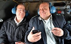 Defense Minister Moshe Ya'alon (left), and then-Maj. Gen. Gadi Eisenkot when Eisenkot learned he had won the appointment to head the Israel Defense Forces, November 27, 2014. (Ariel Hermoni/Ministry of Defense)