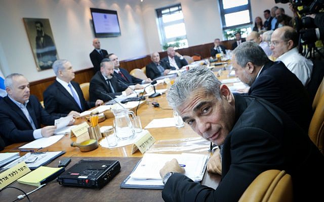 Finance Minister Yair Lapid attends the weekly cabinet meeting at his office in Jerusalem on November 30, 2014. (photo credit: Alex Kolomoisky/POOL/FLASH90) Finance Minister Yair Lapid attends the weekly cabinet meeting at his office in Jerusalem on November 30, 2014. (photo credit: Alex Kolomoisky/POOL/FLASH90)