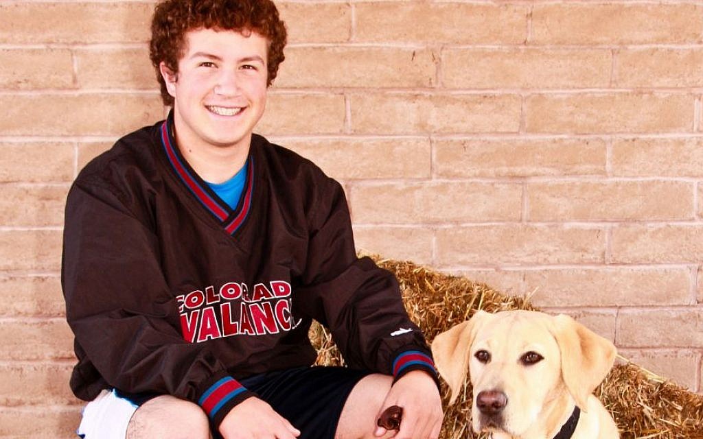 Gabe Baskin with Collier, the puppy he is currently training for guide dog school. (Courtesy of Gabe Baskin/JTA) Gabe Baskin with Collier, the puppy he is currently training for guide dog school. (Courtesy of Gabe Baskin/JTA)