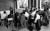 This photo provided Friday, Nov.14, 2014 by the IHES (High Scientific Studies Institute) shows mathematician Alexandre Grothendieck, at the blackboard, during a lesson, south of Paris, in the 1960's. (photo credit: AP Photo/IHES)