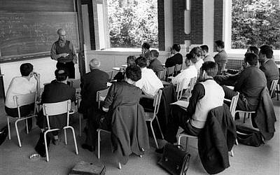 This photo provided Friday, Nov.14, 2014 by the IHES (High Scientific Studies Institute) shows mathematician Alexandre Grothendieck, at the blackboard, during a lesson, south of Paris, in the 1960's. (photo credit: AP Photo/IHES)