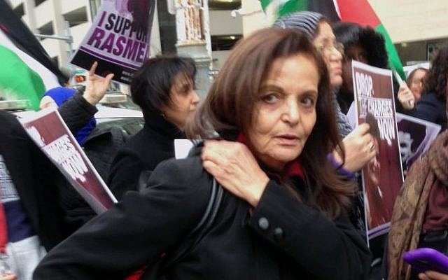 Rasmieh Odeh stands with supporters outside the federal courthouse in Detroit on Tuesday, Nov. 4, 2014 Odeh, associate director at Chicago's Arab American Action Network, is charged with failing to tell US immigration about her conviction for bombings in Israel in 1969 that killed two people at a supermarket. (Photo credit: AP/Ed White) Rasmieh Odeh stands with supporters outside the federal courthouse in Detroit on Tuesday, Nov. 4, 2014 Odeh, associate director at Chicago's Arab American Action Network, is charged with failing to tell US immigration about her conviction for bombings in Israel in 1969 that killed two people at a supermarket. (Photo credit: AP/Ed White)