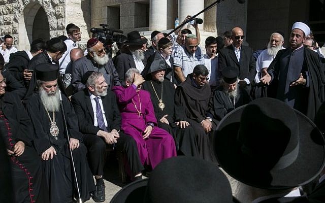 Sheikh Samir Assi, the imam of the Al-Jazaar mosque in the northern Israeli city of Acre, addresses Christian, Muslim and Jewish clerics outside the synagogue where on Tuesday two Palestinian terrorists killed five Israelis, in Jerusalem on Wednesday, Nov. 19, 2014. (Photo credit: AP Photo/Olivier Fitoussi) Sheikh Samir Assi, the imam of the Al-Jazaar mosque in the northern Israeli city of Acre, addresses Christian, Muslim and Jewish clerics outside the synagogue where on Tuesday two Palestinian terrorists killed five Israelis, in Jerusalem on Wednesday, Nov. 19, 2014. (Photo credit: AP Photo/Olivier Fitoussi)