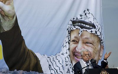 Palestinian Authority President Mahmoud Abbas addresses supporters during a ceremony marking the 10th anniversary of the Palestinian leader Yasser Arafat's death, at the his headquarters in the West Bank city of Ramallah, Tuesday, Nov. 11, 2014. (AP Photo/Nasser Nasser)