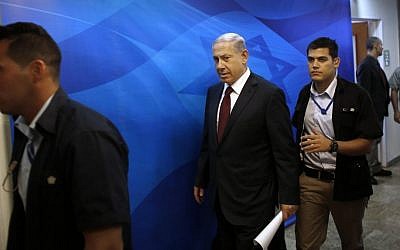 Prime Minister Benjamin Netanyahu (center), arrives for the weekly cabinet meeting in Jerusalem, Sunday, November 2, 2014. (photo credit: AP/Ronen Zvulun, Pool)