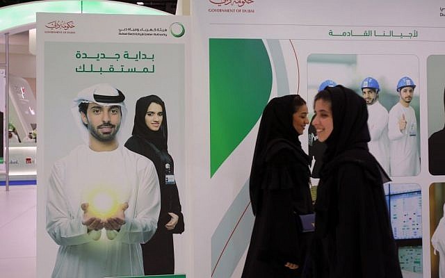 Emirati women pass by posters at a government stand during the Careers UAE opening exhibition exclusively for UAE Nationals in Dubai, United Arab Emirates. UAE’s late leader Sheik Zayed bin Sultan Al Nahyan patronized tribes and villages under his leadership by establishing an expansive welfare program that younger generations of Emiratis have come to expect. This gravy train has created a vast middle class of Emiratis who almost entirely rely on the government for jobs and benefits to maintain their standard of living. Tuesday, April 22, 2014 (photo credit: AP/Kamran Jebreili) Emirati women pass by posters at a government stand during the Careers UAE opening exhibition exclusively for UAE Nationals in Dubai, United Arab Emirates. UAE’s late leader Sheik Zayed bin Sultan Al Nahyan patronized tribes and villages under his leadership by establishing an expansive welfare program that younger generations of Emiratis have come to expect. This gravy train has created a vast middle class of Emiratis who almost entirely rely on the government for jobs and benefits to maintain their standard of living. Tuesday, April 22, 2014 (photo credit: AP/Kamran Jebreili)