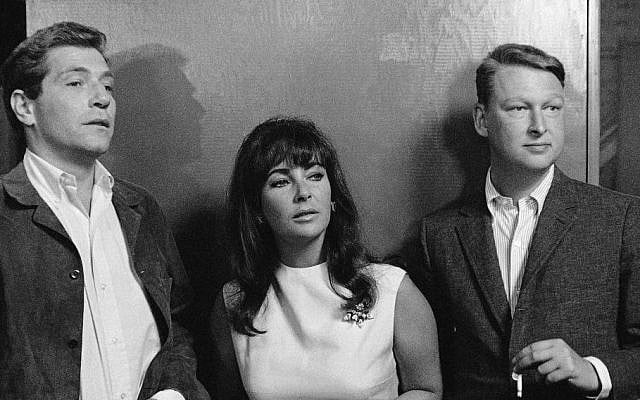 Elizabeth Taylor is flanked by actor George Segal (L), a co-star in “Who’s Afraid of Virginia Woolf?” and Mike Nichols (R) director of the film, as they watched preparation in this Oct. 20, 1965 file photo taken in Hollywood. (photo credit: AP/File) Elizabeth Taylor is flanked by actor George Segal (L), a co-star in “Who’s Afraid of Virginia Woolf?” and Mike Nichols (R) director of the film, as they watched preparation in this Oct. 20, 1965 file photo taken in Hollywood. (photo credit: AP/File)