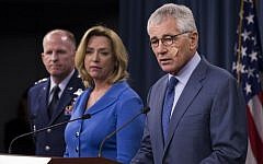 Defense Secretary Chuck Hagel speaks during a news conference at the Pentagon, Friday, Nov. 14, 2014, where he announced that he is ordering top-to-bottom changes in how the nation's nuclear arsenal is managed. From left are, Air Force Global Strike Command Commander Lt. Gen. Stephen Wilson, Air Force Secretary Deborah Lee Jones, and Hagel. (photo credit: AP/Evan Vucci)