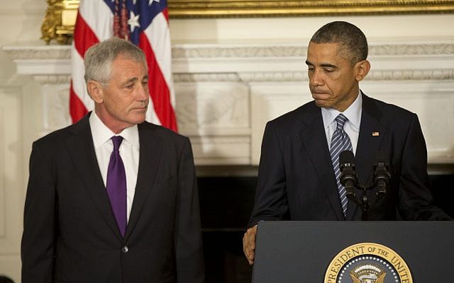 President Barack Obama, standing with Defense Secretary Chuck Hagel, talks about Hagel's resignation during an event in the State Dining Room of the White House in Washington, Monday, Nov. 24, 2014. (photo credit: AP Photo/Pablo Martinez Monsivais) President Barack Obama, standing with Defense Secretary Chuck Hagel, talks about Hagel's resignation during an event in the State Dining Room of the White House in Washington, Monday, November 24, 2014. (photo credit: AP Photo/Pablo Martinez Monsivais)