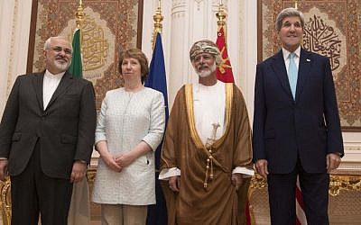 Posing for a photo are, from left, Iranian Foreign Minister Javad Zarif, European Union adviser Catherine Ashton, Omani Minister Responsible for Foreign Affairs Yussef bin Alawi and US Secretary of State John Kerry, in Muscat on Sunday Nov. 9, 2014. Talks are underway in high-level negotiations to limit Iran's nuclear program in exchange for easing crippling sanctions on the Islamic republic's economy. (photo credit: AP PHOTO/NICHOLAS KAMM, POOL)