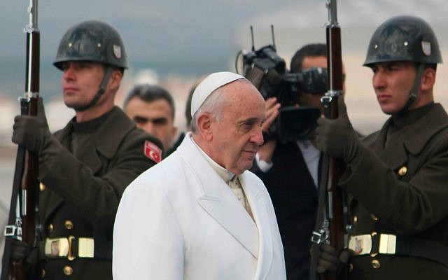 Pope Francis walks past the honor guard as he arrives at the Esenboga airport in Ankara on November 28, 2014. (photo credit: AP Photo/STR) Pope Francis walks past the honor guard as he arrives at the Esenboga airport in Ankara on November 28, 2014. (photo credit: AP Photo/STR)