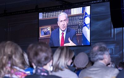 Prime Minister Benjamin Netanyahu addressing the Jewish Federations of North America’s General Assembly in suburban Washington by video link, Nov. 11, 2014. (photo credit: Ron Sachs)