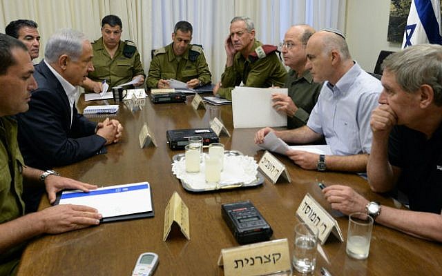 A June 14, 2014 meeting attended by, from right, Mossad head Tamir Pardo, Shin Bet head Yoram Cohen, Defense Minister Moshe Ya'alon, Lt. Gen. Benny Gantz, Maj. Gen. Aviv Kovhavi, Maj. Gen. Yoav Mordechai and, opposite Cohen, Prime Minister Benjamin Netanyahu (photo credit: Kobi Gideon/ GPO/ Flash 90)
