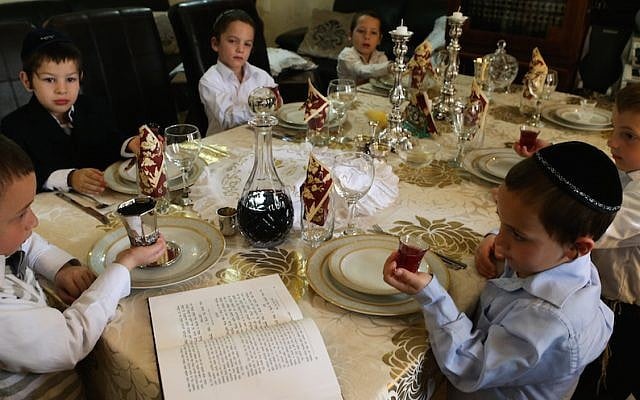 Children make kiddush at a model Passover seder (Nati Shohat/Flash90) Children make kiddush at a model Passover seder (Nati Shohat/Flash90)