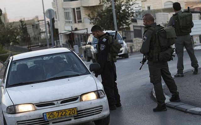 Israeli border police check the ID's of Arab-Israelis outside the East Jerusalem neighborhood of Jabel Mukaber on November 19, 2014. Photo credit: Nati Shohat/FLASH90) Israeli border police check the ID's of Arab-Israelis outside the East Jerusalem neighborhood of Jabel Mukaber on November 19, 2014. Photo credit: Nati Shohat/FLASH90)