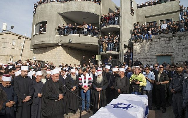 Mourners at the funeral of Israeli police officer Zidan Saif, 30, in the northern Druze village of Yanuh-Jat, on November 19, 2014 (photo credit: AFP/Jack Guez)