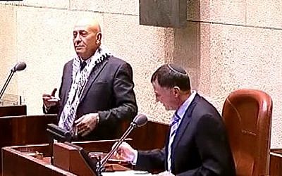 Balad MK Basel Ghattas and Knesset Speaker Yuli Edelstein on November 12, 2014 (photo credit: YouTube screenshot) Balad MK Basel Ghattas and Knesset Speaker Yuli Edelstein on November 12, 2014 (photo credit: YouTube screenshot)