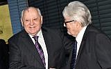 Former Soviet Leader Mikhail Gorbachev and former French Foreign Minister Roland Dumas greet each others at the 25th anniversary of the fall of the Berlin wall in 2014. (Photo credit: AP/dpa/Jens Kalaene)