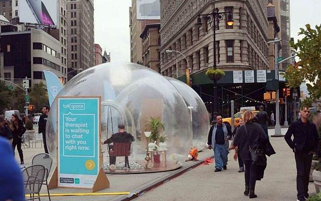 New York residents stroll past large transparent bubbles planted in Manhattan's Fifth Avenue by Israeli start up, Talkspace. November 12, 2014. (photo credit: courtesy) New York residents stroll past large transparent bubbles planted in Manhattan's Fifth Avenue by Israeli start up, Talkspace. November 12, 2014. (photo credit: courtesy)