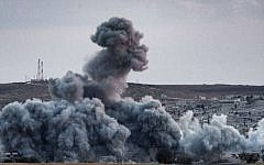 Smoke rises above from Syrian Kurdish town of Kobani, on November 2, 2014 (photo credit: AFP/ Stringer)