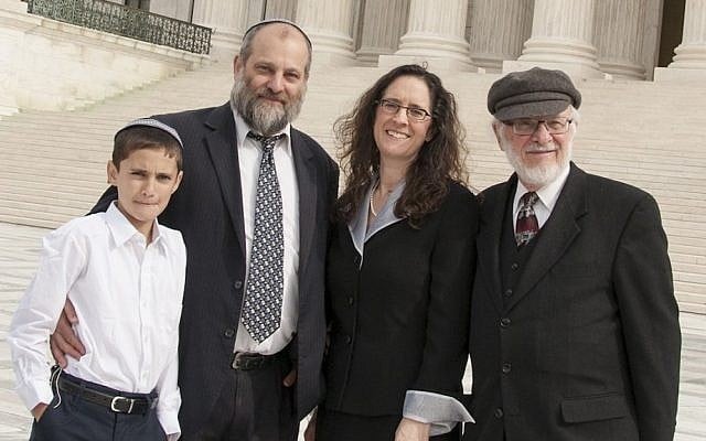 Menachem Zivotofsky, left, and his father Ari posing in front of the Supreme Court with their attorney Alyza Lewin and Lewin’s father Nathan, November 3, 2014 (Rikki Gordon Lewin) Menachem Zivotofsky, left, and his father Ari posing in front of the Supreme Court with their attorney Alyza Lewin and Lewin’s father Nathan, November 3, 2014 (Rikki Gordon Lewin)