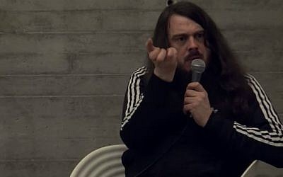 Controversial German performance artist Jonathan Meese addressing an audience on January 21, 2012. (screen capture: YouTube)