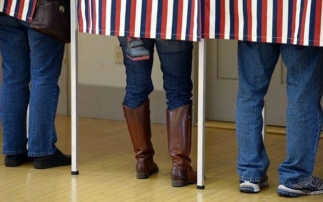 Voters cast their ballots at Madbury Town Hall November 4, 2014 in Madbury, New Hampshire (photo credit: Darren McCollester/Getty Images/AFP) Voters cast their ballots at Madbury Town Hall November 4, 2014 in Madbury, New Hampshire (photo credit: Darren McCollester/Getty Images/AFP)