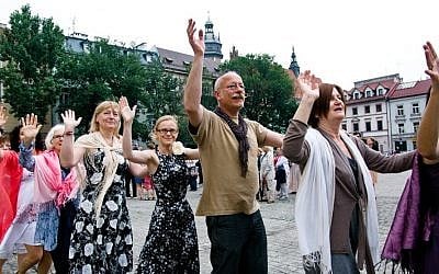 Revelers dancing at the Jewish Culture Festival in Krakow, one of many Jewish culture festivals in Poland. (Photo credit: Wojciech Karlinski)