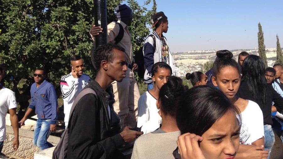 Ethiopian-Israeli teens hanging out on the Tayelet (photo credit: Jessica Steinberg/Times of Israel)