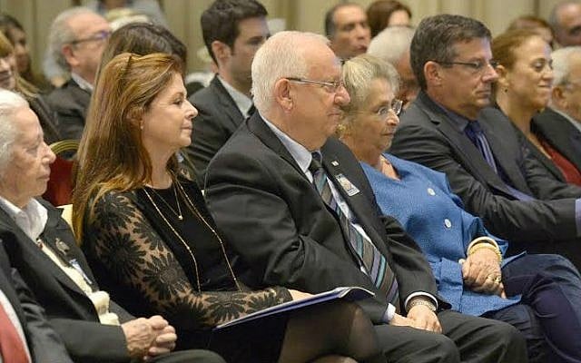 Presdient Reuven Rivlin (C) and members of the Rabin family at a memorial marking the 19th anniversary of the assassination of prime minister Yitzhak Rabin, Tuesday, Nov 4, 2014 (photo credit: Mark Neyman/GPO)